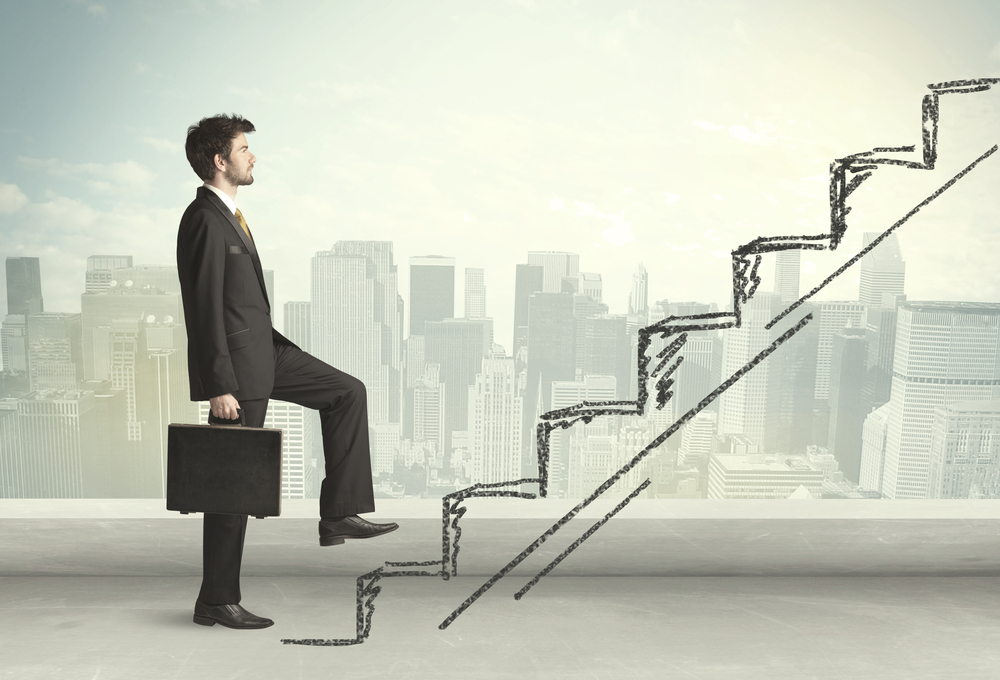 Business man climbing up on hand drawn staircase concept on city background