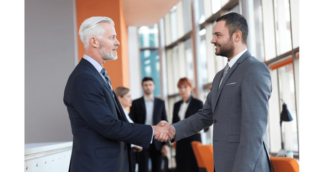 business20partners,20partnership20concept20with20two20businessman20handshake-1